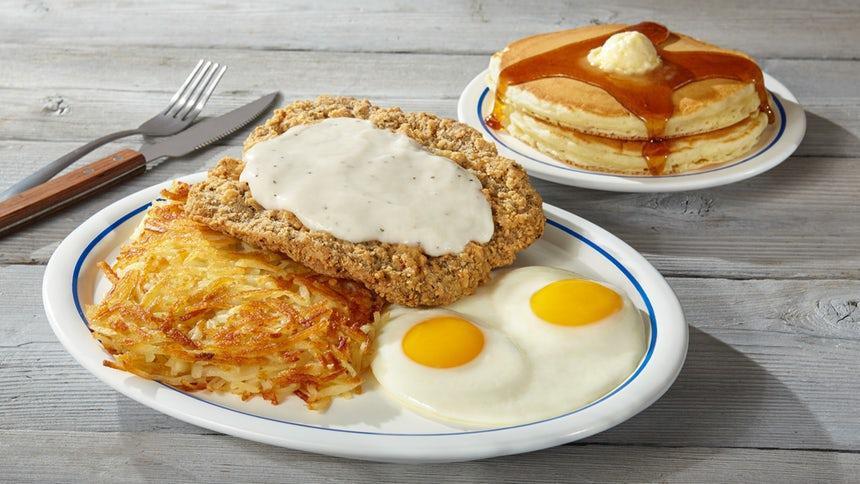 Country Fried Steak & Eggs · Golden-battered beef steak smothered in hearty gravy.. Served with 2 eggs* your way, hash browns & 2 buttermilk pancakes.