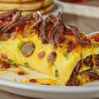 Colorado Omelette · Bacon, shredded beef, pork sausage & ham with green peppers, onions & Cheddar. Served with o...