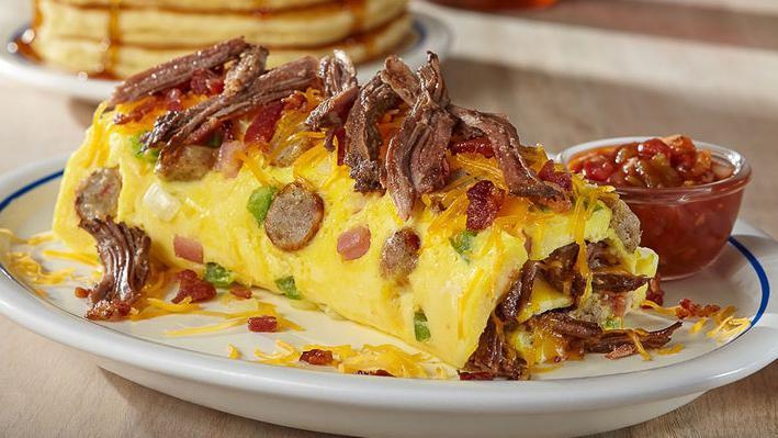 Colorado Omelette · Bacon, shredded beef, pork sausage & ham with green peppers, onions & Cheddar. Served with our salsa.