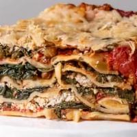 Spinach Vegetarian Lasagna · Made with roasted vegetables, zucchini, carrots, onions, and spinach in a marinara base sauce.
