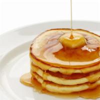 Original Buttermilk Pancakes · Perfectly fluffy pancakes served with a side of butter and syrup.