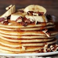 Banana Nut Pancakes · Perfectly fluffy banana nut pancakes served with a side of butter and syrup.