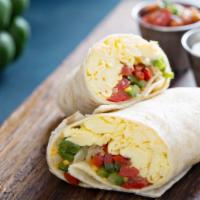 Vegetarian Breakfast Burrito · Fresh eggs, spinach, onions, tomatoes, potatoes, garlic, and cheese wrapped in a fresh made ...