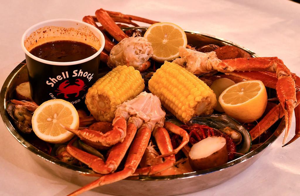 Combo #2 · Select 1 option from: whole Dungeness crab, whole lobster, snow crab legs (1.5 pounds). Select 2 pounds from: clams, shrimp, shrimp head off (for an additional charge), crawfish, mussels. Includes 2 corns, 2 potatoes and 4 pieces of sausage.