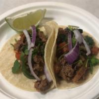 TACOS! STEAK · 2 STEAK TACOS 
Served on corn tortillas, with onion, cilantro and drizzled with sauce.