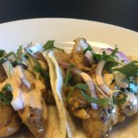 TACOS! CHICKEN · 2 CHICKEN TACOS 
Served on corn tortillas, with onion, cilantro and drizzled with sauce.