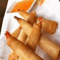 Prawns in a Blanket · Deep fried marinated prawns wrapped in egg roll skins served with sweet & sour sauce