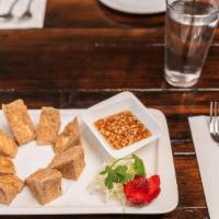 Golden Tofu  · Crispy tofu served with Thai sweet chili sauce topped by ground roasted peanuts
