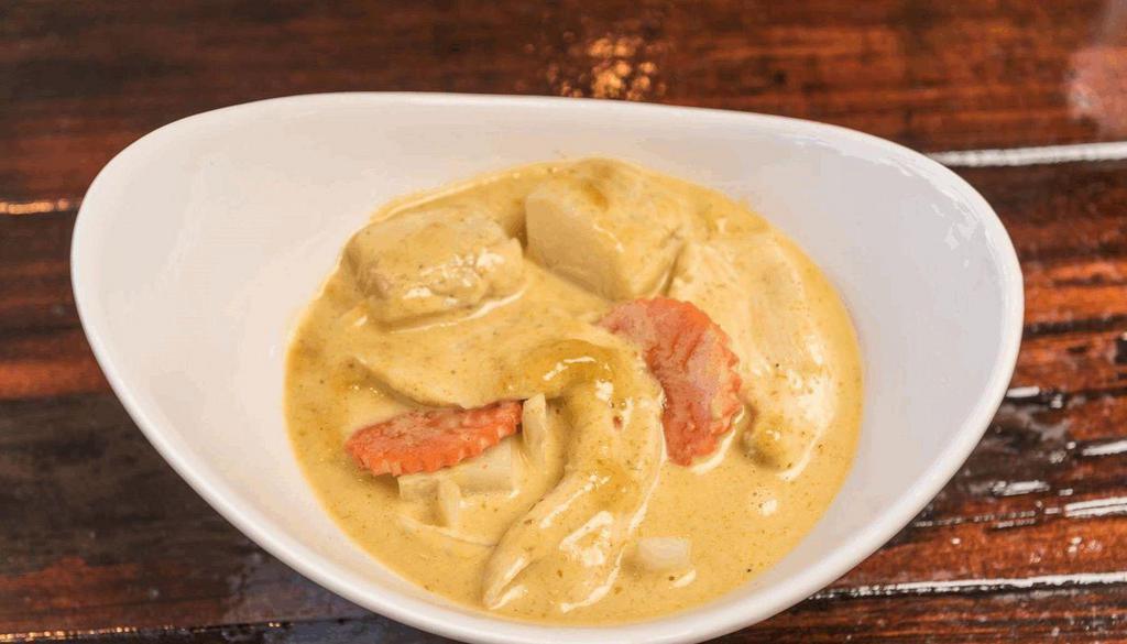 Yellow Curry  · Simmered in yellow curry spices, with coconut milk, potato, onion and carrots