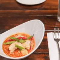 Red Curry  · Simmered in red curry spices, with coconut milk, bamboo shoots, green beans, bell peppers an...