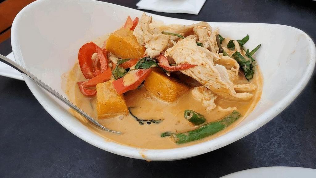 Pumpkin Curry · Simmered in red curry spices, with coconut milk, green beans, bell peppers, pumpkin and basil leaves