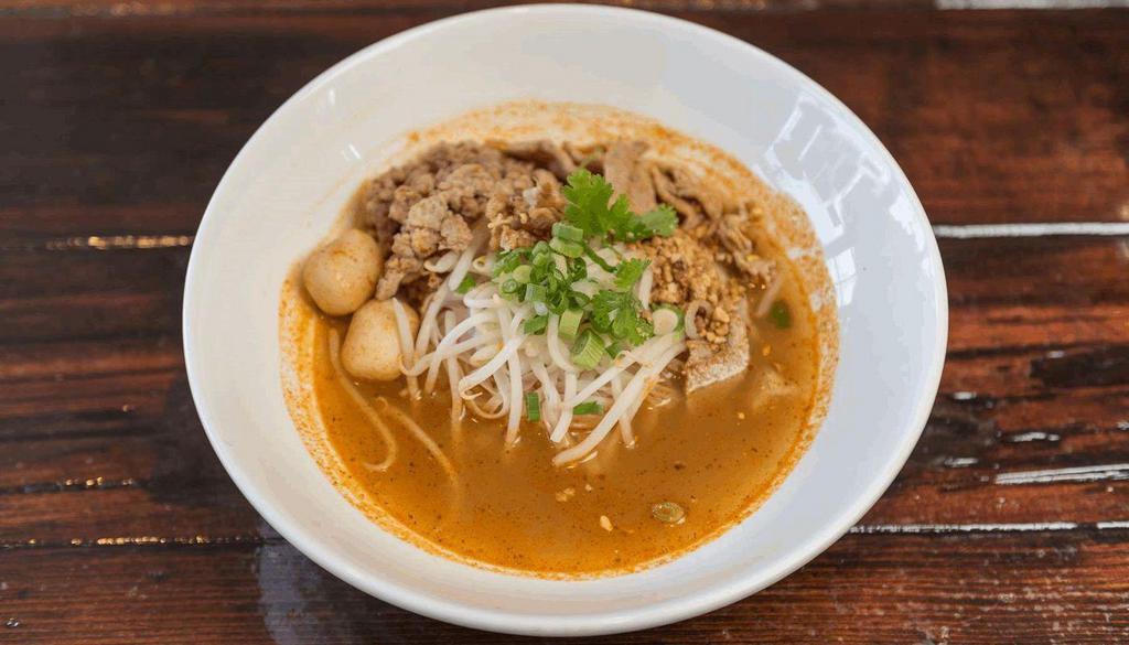 Spicy Noodle Soup   · Rice noodles, ground pork, ground peanuts, green onions, and bean sprouts in spicy Thai style broth