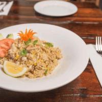 Crab Fried Rice    · Fried rice with crab meat, eggs, and onions, served with fresh sliced cucumber