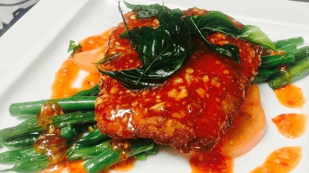 Sweet Sole     · Pan-fried ﬁlet of sole garnished with aromatic crispy basil leaves, served with string beans, tomatoes and hot & sour sauce