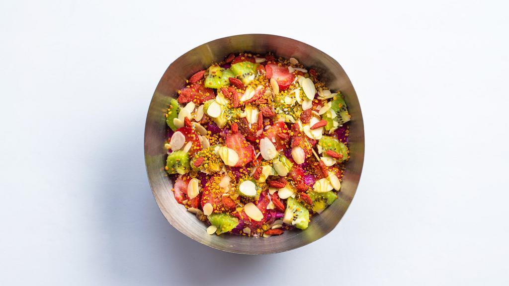 Dragon Bowl · Medium: 350 cal, large: 460 cal. Base: Pitaya, Banana, Pineapple, Raspberries, Immunity Boost, Coconut Milk, Mango Juice. Toppings: Strawberries, Kiwi, Almonds, Organic Goji Berries, Bee Pollen, Honey.