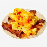 Bacon Breakfast Taco · Scrambled eggs, bacon, melted cheese and salsa.