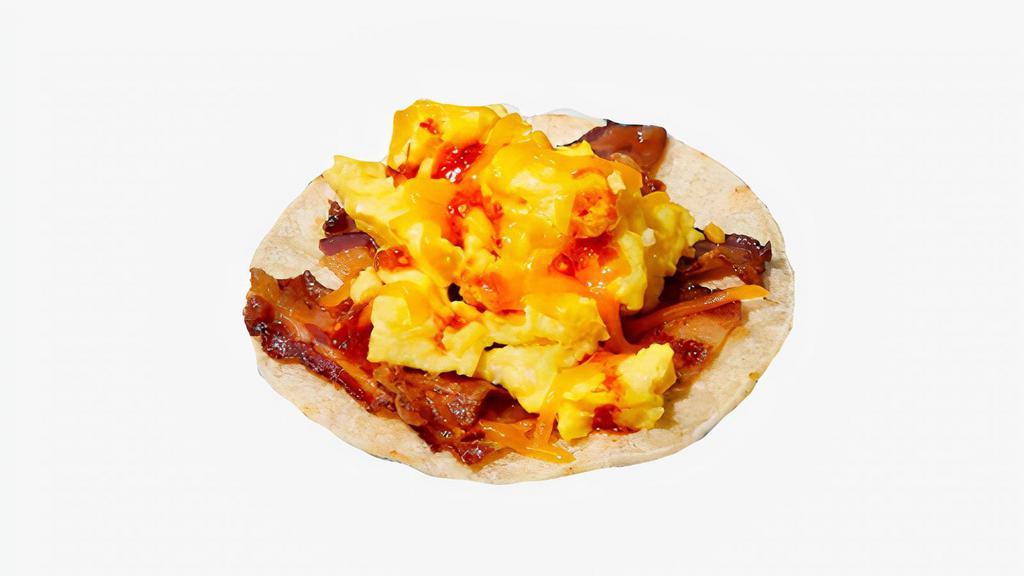 Bacon Breakfast Taco · Scrambled eggs, bacon, melted cheese and salsa.