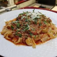 Bolognese Tagliatelle · Ribbon pasta covered with a sauce made from ground beef, tomato, onion, and herbs.