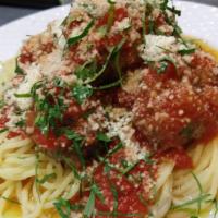Spaghetti with Meatballs · Spaghetti with five ground beef meatballs covered in marinara sauce.