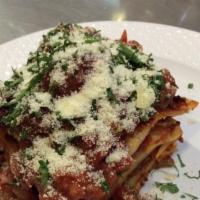 Meat Lasagna · Lasagna made of ground beef, covered in Bechamel sauce and ricotta.