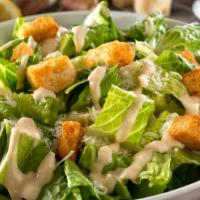 Caesar Salad · Romaine lettuce, pepperoncini, croutons, cheese, and dressing.