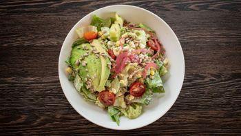 Chopped Salad · Butter lettuce, avocado, cherry tomatoes, hard boiled egg, sunflower seeds, pickled onion, cucumber, herb buttermilk dressing