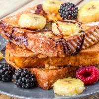 Berries & Banana French Toast · 2 slices of Classic French Toast freshly prepared and cooked to perfection. Topped fresh a m...