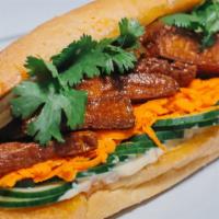 Outer Bánh Mi · Fried house-made vegan spam, vegan miso aioli, sriracha, cucumber, pickled carrot & jalapeño...