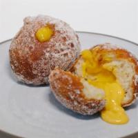 Malasadas · 2 Hawaiian-style donuts filled with a house-made passsion-fruit curd, tossed in sugar (veget...
