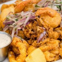 Jalea (Fried Seafood) · Fried calamari, shrimp, mussels, clams, fillet of fish and Cassava roots, served with Salsa ...