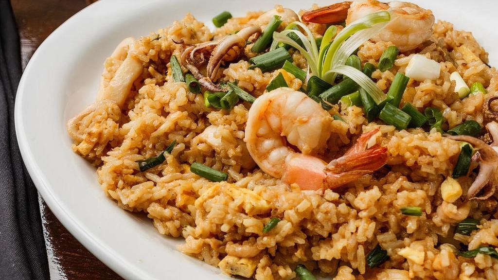 Chaufa de Mariscos · Chinese inspired Peruvian style seafood fried rice mixed with scrambled eggs, green onions and soy sauce.