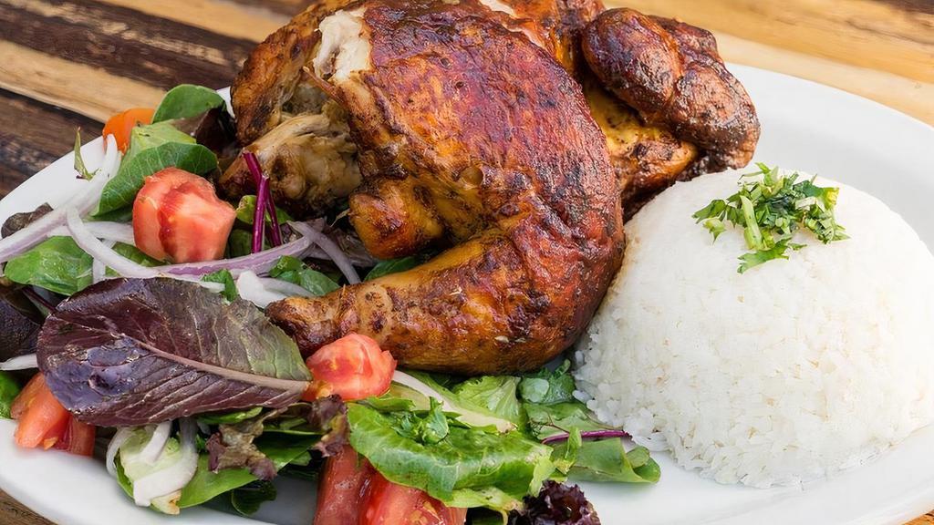 Whole Rotisserie Chicken · Rotisserie chicken marinated in more than 8 herbs, spices, and lime juice, cooked in our imported Peruvian oven and served with salad and choice of rice or fries. *Additional sides available with an upcharge.