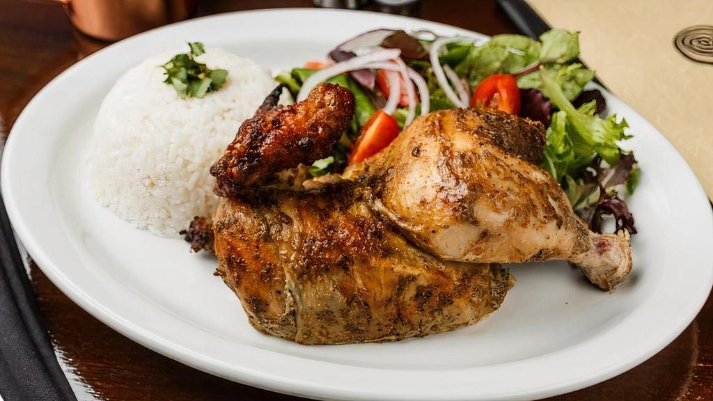 1/2 Rotisserie Chicken · Rotisserie chicken marinated in more than 8 herbs, spices, and lime juice, cooked in our imported Peruvian oven and served with salad and choice of rice or fries. *Additional sides available with an upcharge.