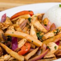 Saltado de Pollo · Stir fried chicken, onions, tomatoes, fried potatoes, cilantro and soy sauce, served with ga...