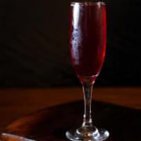 Mimosa - Chicha (Purple Corn) · Champagne with your choice of orange juice, Passion Fruit juice, or Purple Corn juice.