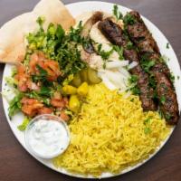 Kafta Kabab Plate · Marinated ground beef and lamb, mixed with onion, parsley, served with rice, fresh anion, Sa...
