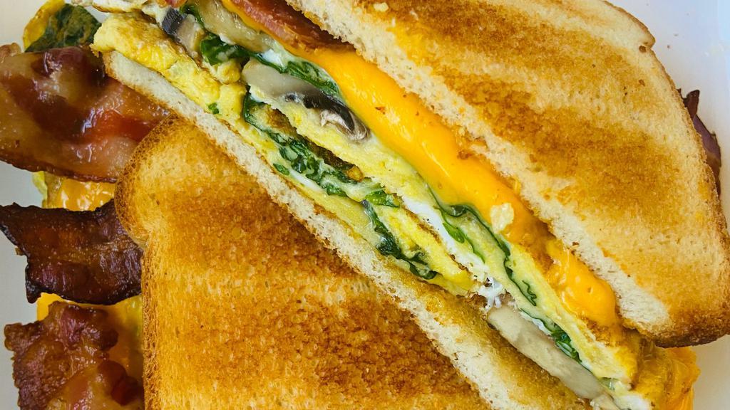 Veggie Breakfast Sandwich · Spinach, mushroom, egg and cheese.