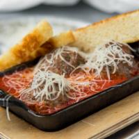 Meatballs · Three housemade meatballs in marinara, garnished with aged Parmesan and focaccia dipping bre...
