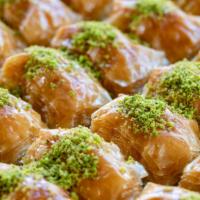 Pistachio Baklava · Delicate layered filo pastry, filled with finely chopped pistachios and drenched with honey.