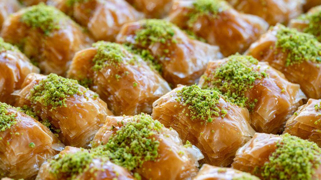 Pistachio Baklava · Delicate layered filo pastry, filled with finely chopped pistachios and drenched with honey.