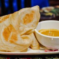 1. Roti Canai · Homemade indian style pancake with curry dipping sauce.