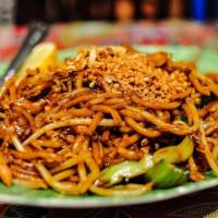 115. Mee Goreng Fried Noodle · Indian style stir fried yellow noodle in special mild sauce with shrimp, tomato, bean sprout...