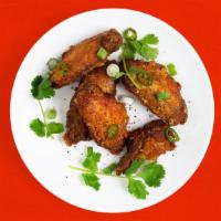 House Fried Chicken Wings · Served with garlic soy sauce.