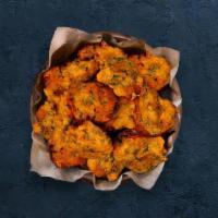 Vegetable Pakora · Perfectly fried assortment of battered farm-fresh vegetables and herbs.