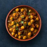 Channa Masala · Chickpeas cooked with farm-fresh vegetables and special herbs.