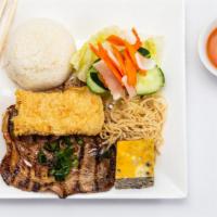 Tấm đặc biệt · Broken rice with shredded pork, pork cake, bean curd, and a choice of meat