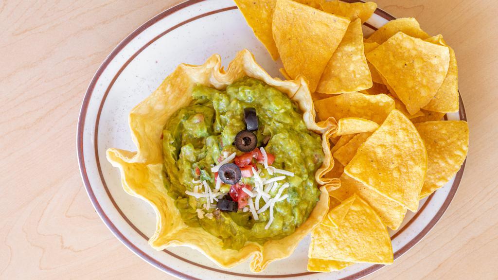 Guacamole · A rich blend of avocados, served with flour tortilla chips,garnished with sour cream and diced tomatoes.