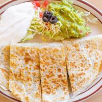 Meat Quesadilla · Your choice of meat served with guacamole and sour cream.