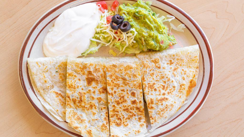 Meat Quesadilla · Your choice of meat served with guacamole and sour cream.