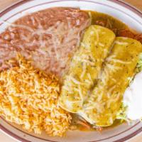 Enchiladas Suizas · Two corn tortillas rolled and filled with our delicious seasoned chicken meat, covered with ...
